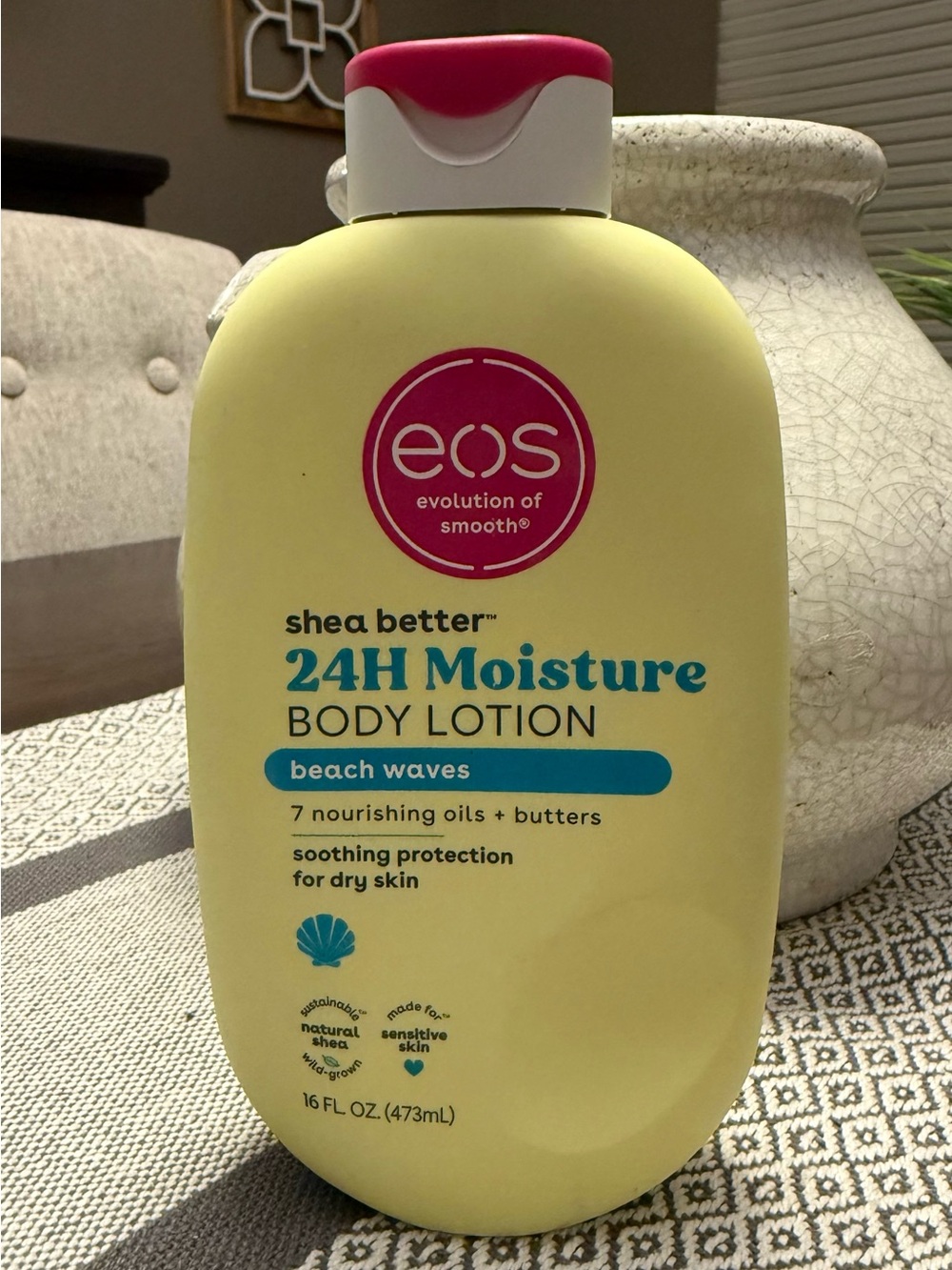 eos 24H Moisture Body Lotion in yellow with pink cap